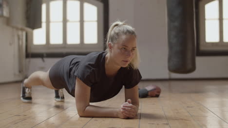 Long-shot-of-focused-and-fit-woman-making-plank-exercise